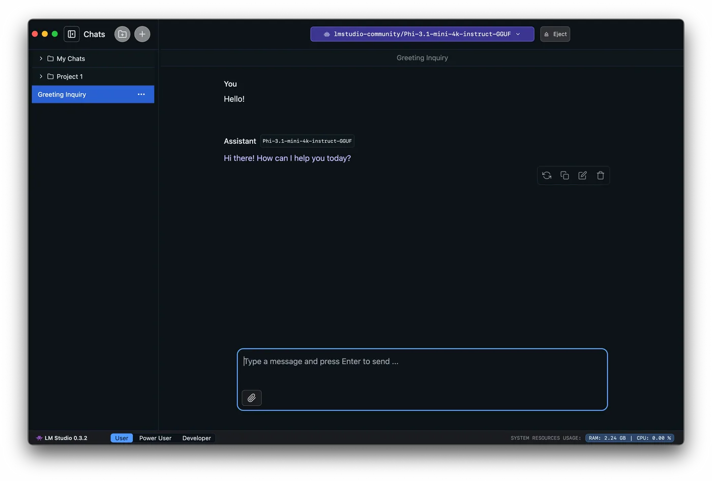 LM Studio's Chat tab with a loaded Phi-3.1-mini-4k-instruct model replying 'Hi there! How can I help you today?' to a 'Hello!' message